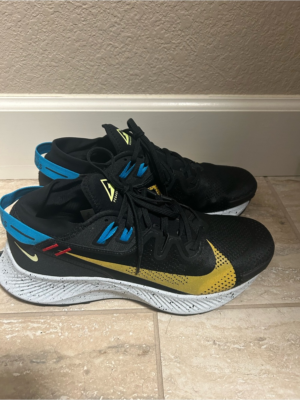 Nike Men’s Black & Gold Athletic Sneakers with Blue Accents